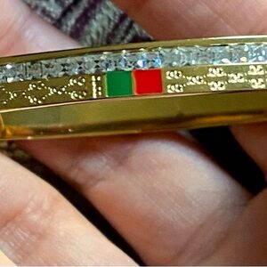 Gold Tone Crystal Bangle Bracelet with Green and Red Accents